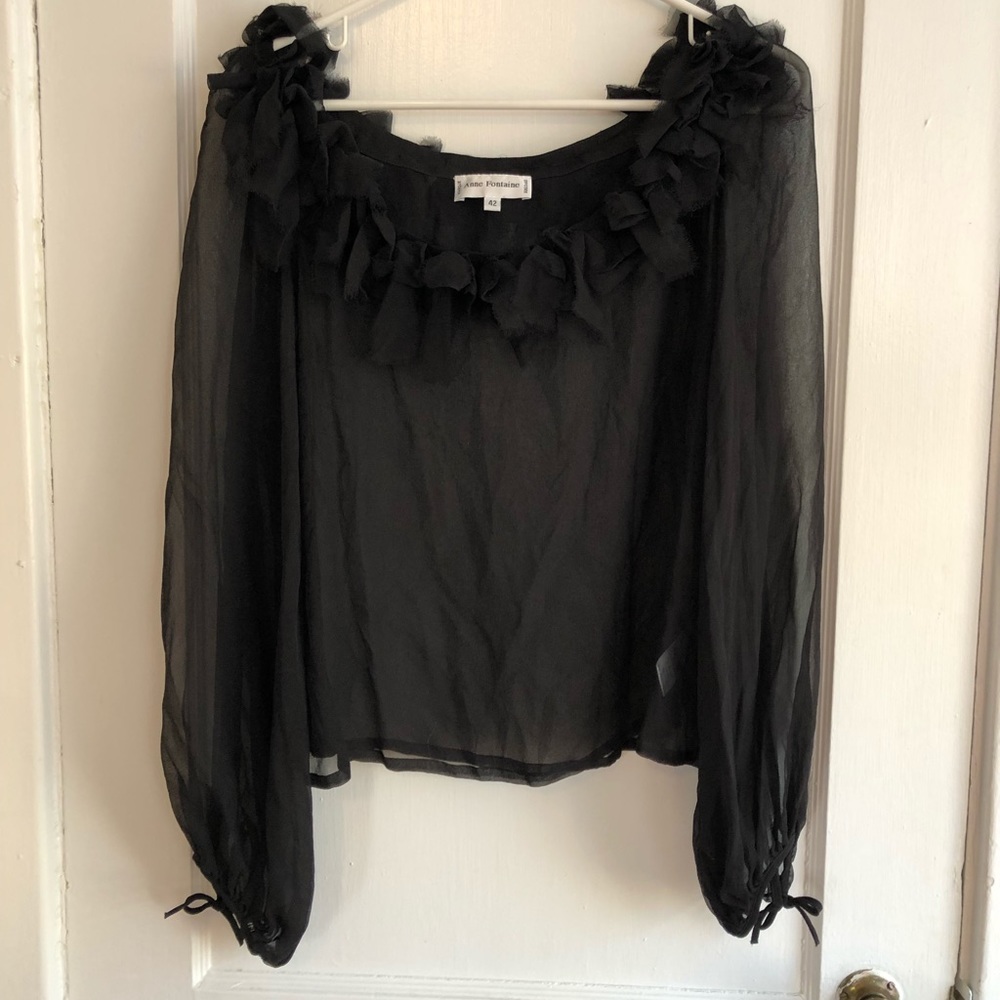 Sheer top w/ ruffle neckline.